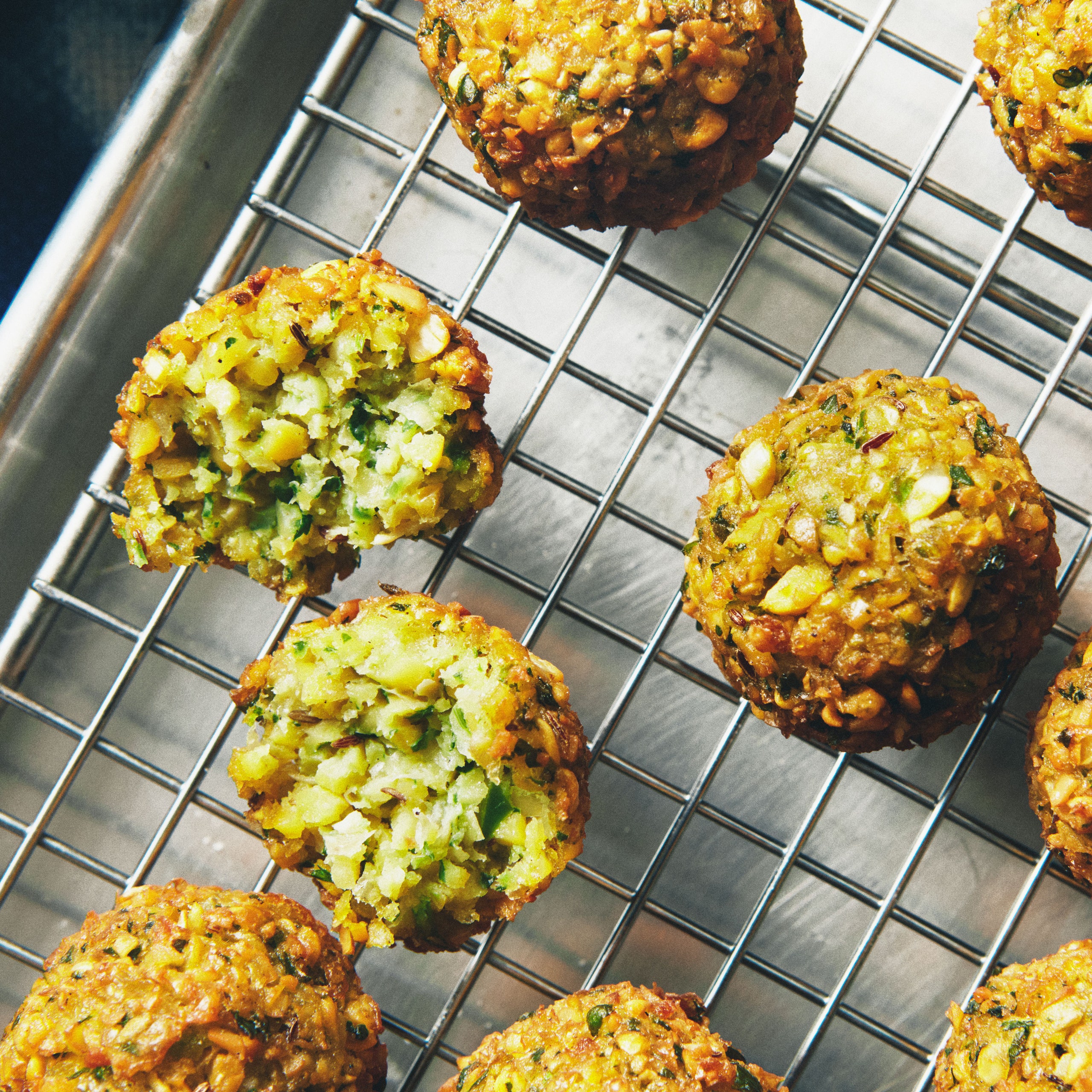 Falafel on a wire rack.